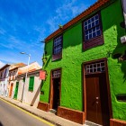 Along Calle Pedro Zerolo, vibrant colonial façades and historic wooden window frames reflect the Canarian tradition of San Cristóbal de La Laguna, on the street leading to the historic University.