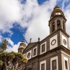 In San Cristóbal de La Laguna, the Church of La Concepción combines volcanic stone, white façades and bell towers, reflecting Canarian religious architecture.