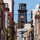 Along Calle Marqués de Celada, Canarian façades and traditional balconies frame the historic Torre de la Concepción, a stone landmark in the centre of San Cristóbal de La Laguna.