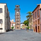 Along Calle Obispo Rey Redondo, La Laguna’s historic Carrera, colonial façades and Canarian balconies lead the eye towards the stone tower of the Church of La Concepción.