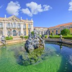 The National Palace of Queluz, located in the municipality of Sintra, within the Lisbon metropolitan area, enchants visitors with its Rococo façade, geometric gardens and spectacular Neptune Fountain.