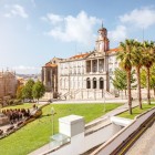 In the heart of Porto, Praça do Infante D. Henrique links the great navigator’s statue with the neoclassical elegance of the Palácio da Bolsa, amid gardens and mercantile history.