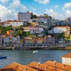 Overlooking the Douro, Porto’s colourful Ribeira district climbs the hillside among historic houses, churches and palaces, while the monumental Dom Luís I Bridge appears on the right.