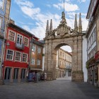 In the heart of Braga, the elegant Arco da Porta Nova, redesigned by André Soares in 1772, frames a historic street lined with colourful façades, azulejo tiles and wrought-iron balconies.
