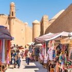 In the Khiva Bazaar, within the walls of Itchan Kala, stalls filled with textiles, ceramics and handicrafts evoke the city’s ancient trading spirit along the Silk Road.