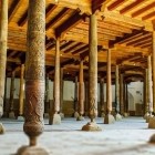 The Juma Mosque features 212 wooden columns spanning centuries: geometric carvings, floral motifs and Kufic inscriptions preserve the artistry of ancient Khiva.