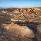 In the Kyzylkum Desert, between Khiva and Bukhara, wind-sculpted formations and ochre hues reveal the authentic face of the ancient Silk Road.
