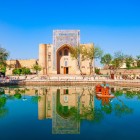 At first sight, Lyabi Hauz enchants with the reflection of the Nadir Divan-Begi Khanaka, a 1620 Sufi retreat overlooking the historic pool in the heart of Bukhara.