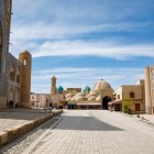 Bukhara’s Kosh Madrasah complex brings together the Ulugh Beg and Abdulaziz Khan madrasas, framing the domes of Toki Zargaron in a historic setting.