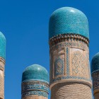 The four towers of the Chor Minor Madrasa, adorned with different motifs and turquoise domes, offer visitors one of Bukhara’s most distinctive silhouettes.
