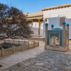 The Saho-khona once held sacred water for pilgrims: four arches and turquoise-domed turrets celebrate life and spirituality at the heart of the sanctuary.