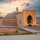 The Rabat-i Malik Sardoba, with its brick dome and pointed-arch portal, kept water cool for merchants, travelers and animals journeying along the Silk Road.