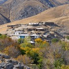 Among the arid slopes of the Nuratau Mountains lies Ukhum, gathered around stone and earthen houses. Trees and gardens follow the water, creating a small mountain oasis.