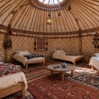 Inside the Aydarkul yurt, the wooden structure, beds and handmade Shyrdak, a traditional felt carpet, reflect Central Asia’s nomadic heritage