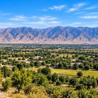 The landscape changes along the way: arid hills give way to fields, orchards and small rural settlements, revealing Uzbekistan’s greener, agricultural side.