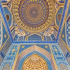Inside the Tilla-Kori, the gaze rises towards the mosque's extraordinary decoration: deep blue, floral motifs and abundant gilding create one of the Registan's most spectacular interiors.