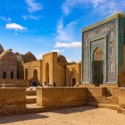 The day continues at the Shah-i-Zinda Necropolis, an extraordinary funerary complex developed over centuries and renowned for its blue and turquoise tiled mausoleums.