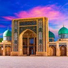 The discovery of the old city begins at the Khast-Imam Complex, the religious heart of Tashkent, characterized by monumental portals and unmistakable turquoise domes.