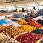 Entering Chorsu Bazaar, stalls filled with dried fruit, nuts, pulses and spices introduce visitors to the colours, aromas and ingredients of Uzbek culinary tradition.