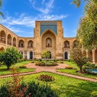 After passing through the entrance of the Kukeldash Madrasa, the courtyard surrounded by arches and ancient cells preserves the intimate layout of the historic Quranic school.