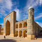 The route offers another perspective of the Kukeldash Madrasa, allowing a closer appreciation of its portal, brick façades and architectural forms.