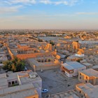 The third day begins by leaving Khiva: viewed from above, earthen houses and historic neighbourhoods accompany the departure towards Bukhara, the next stop along the ancient Silk Road.