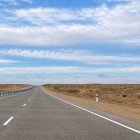 The transfer continues along the A380, crossing the open landscapes of western Uzbekistan and following the historic overland route between Khiva and Bukhara.